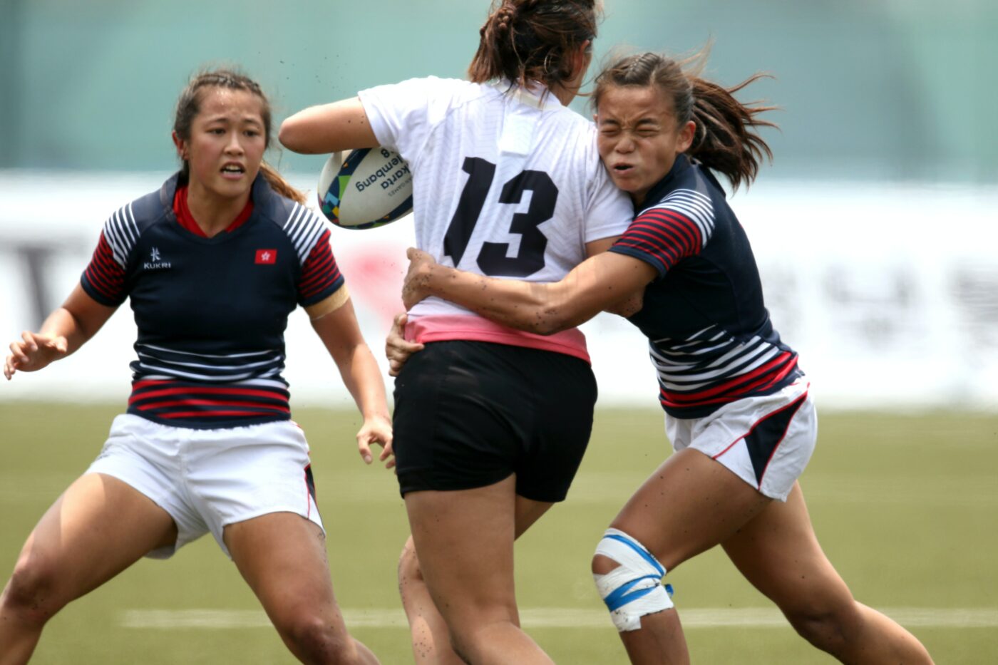 young women playing rugby